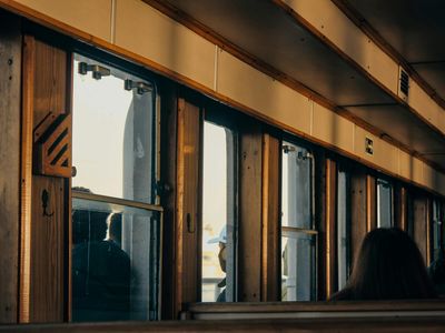 Blurry silhouette of a person moving against a window.